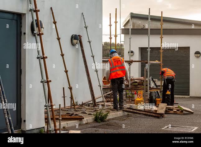 Scaffolders conducting a safety check on a scaffold structure